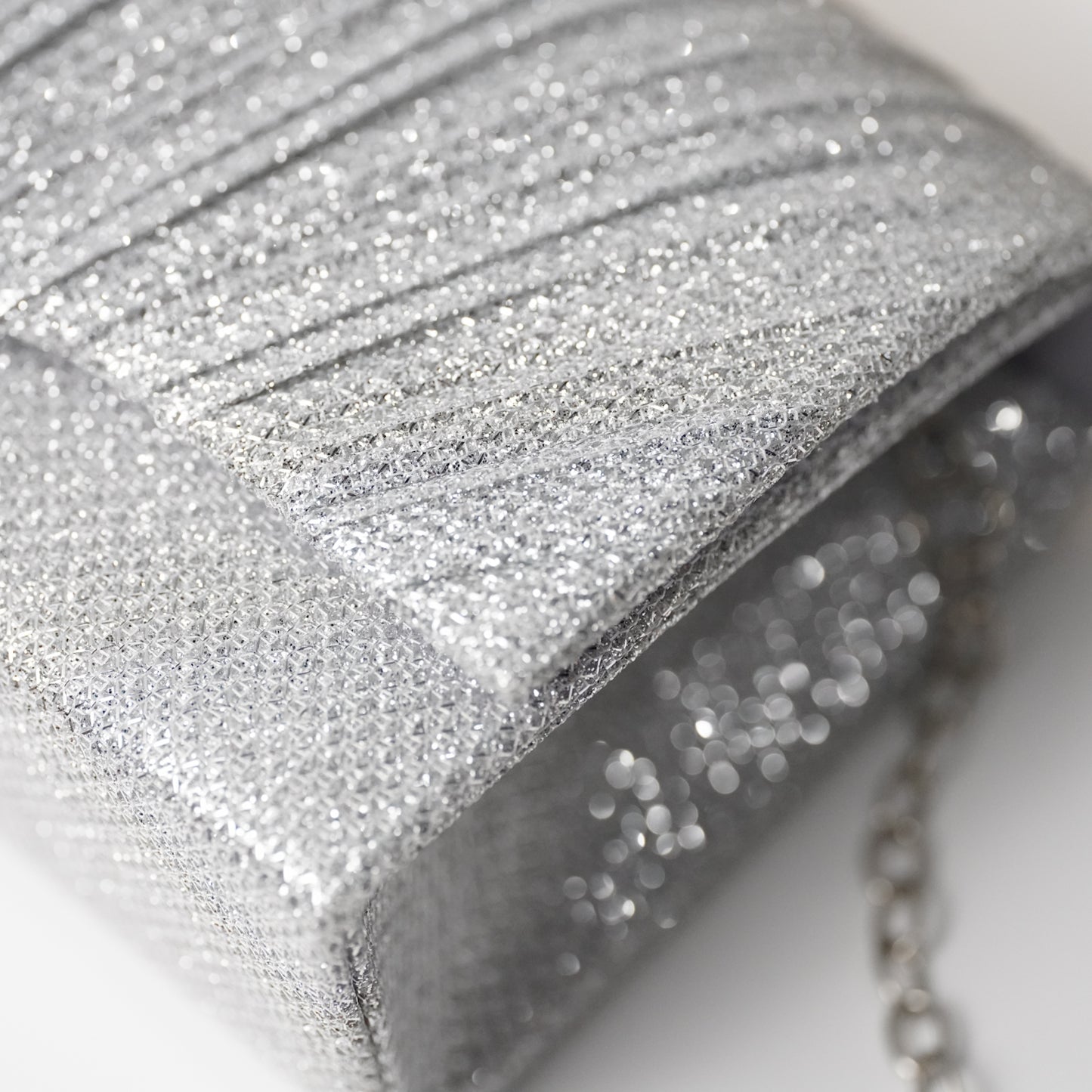 حقيبة سهرة نقشة الصدف فضي